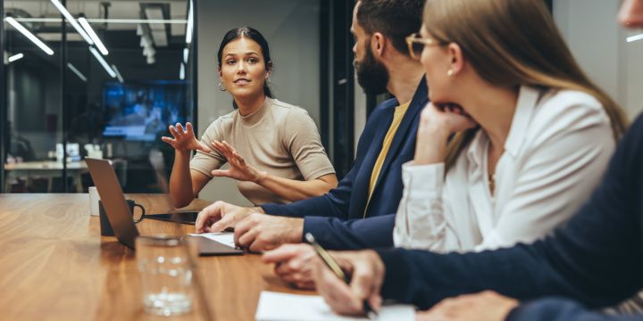 Young businesswoman leading a discussion during a meeting