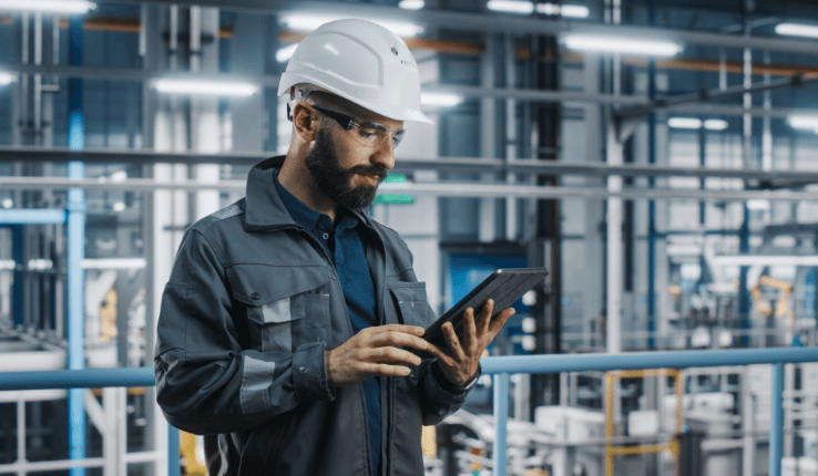 a frontline worker read an announcement on a tablet