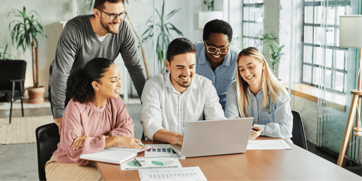 HR communicating around a computer at work