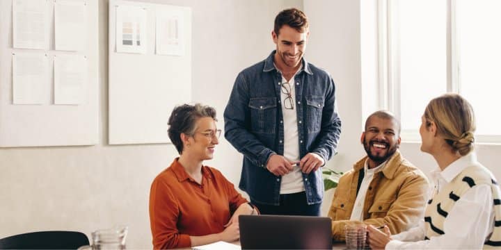 Group of coworkers collaborating in a meeting room 