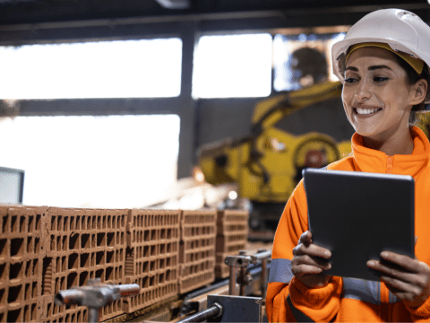 A woman frontline worker in a construction material 